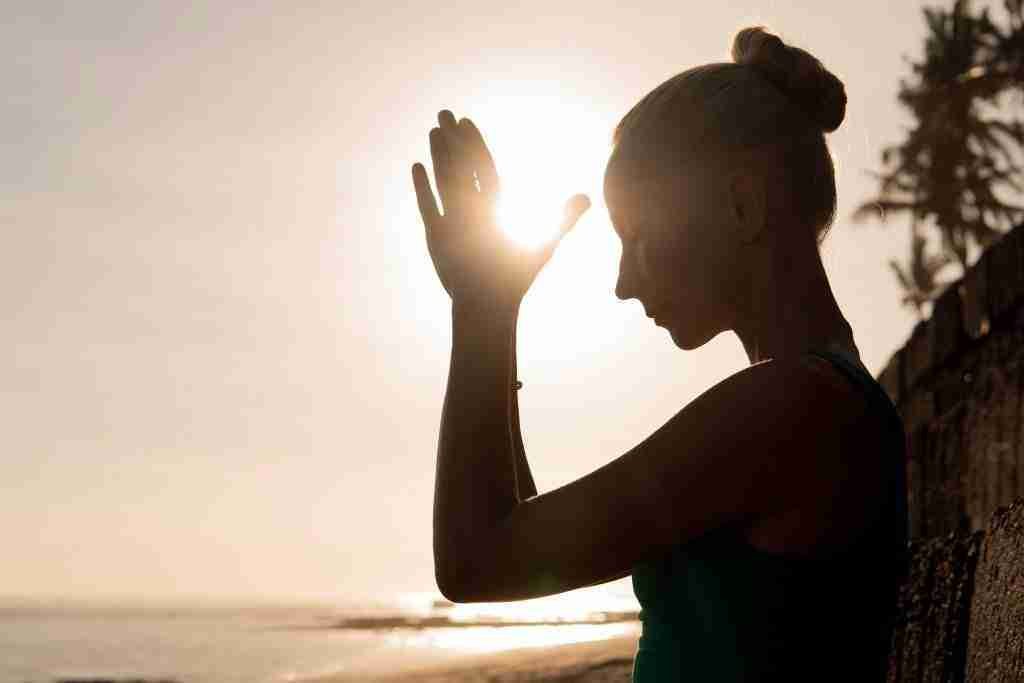 Third Eye Chakra - Important: Why You Must Not Rush To Open Yours? 1 A woman practising opening her third eye chakra