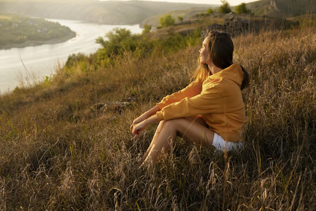 How to Cultivate Self-Love and Acceptance - A Guide for Professional Women 2 side view woman sitting outdoors