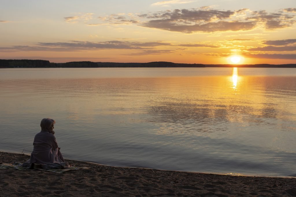 Can Mindfulness Help With Anxiety? 1 sad contemplative person near lake