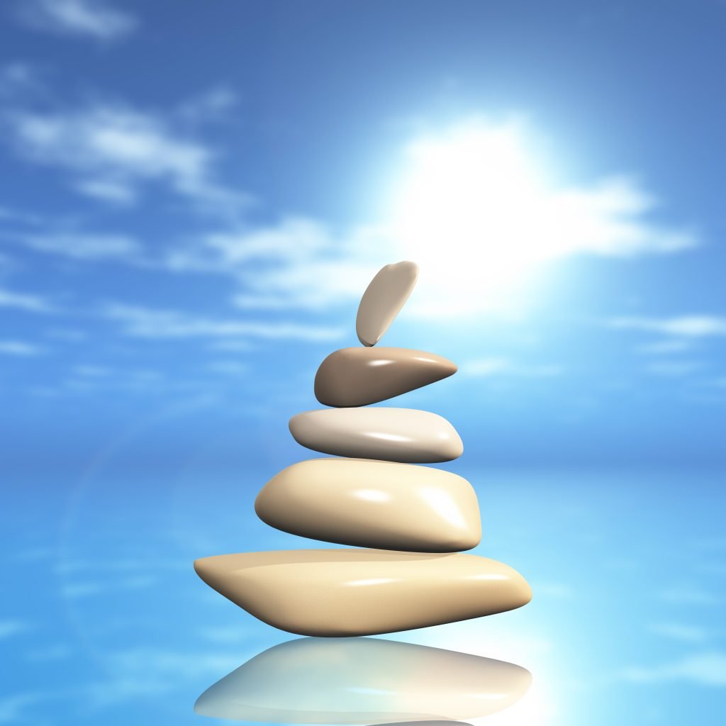 Spiritual Awakening - Balancing Your Mind, Body, and Soul 1 Pebbles in perfect balance, representing the importance of the balance between body, mind and soul