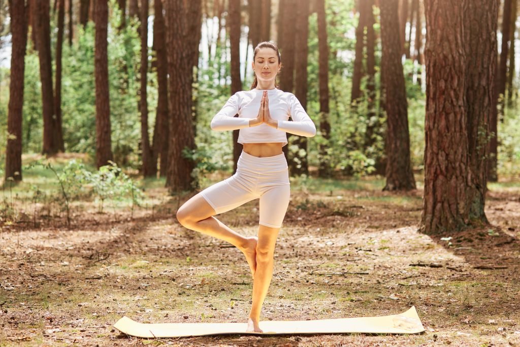 Exploring Different Paths to Spiritual Awakening 2 A woman doing yoga in a forest