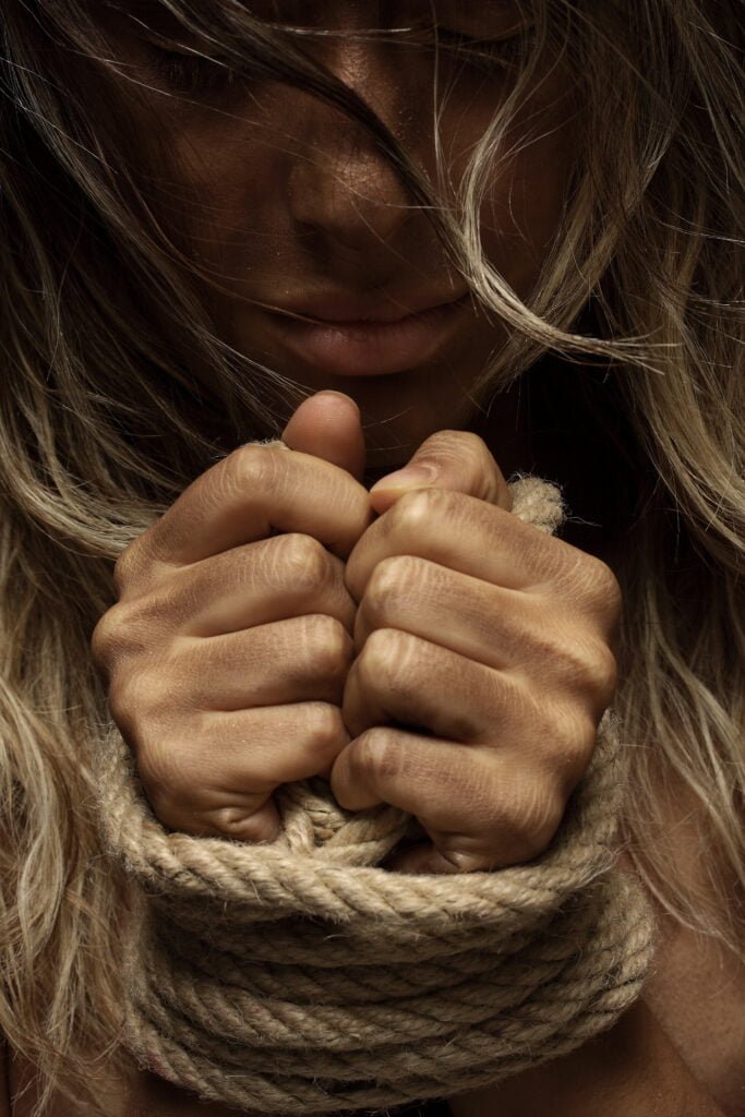 How to Rebuild Self-Love After Experiencing Trauma 2 A woman feeling like a prisoner of her trauma