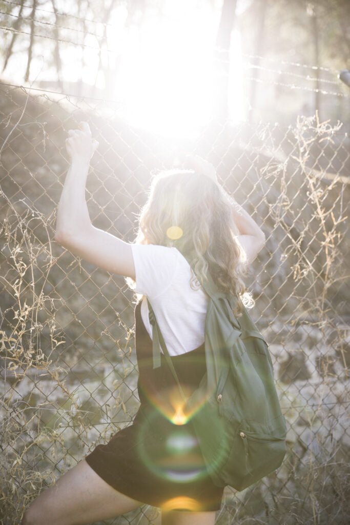 Healing Past Wounds - The Role of Self-Love in Recovery 1 A woman confined by her past unhealed wounds