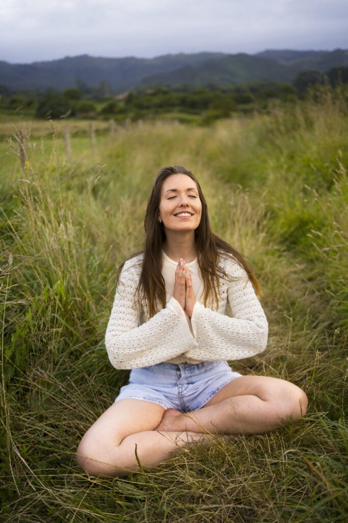 A woman feeling blissful after meditation