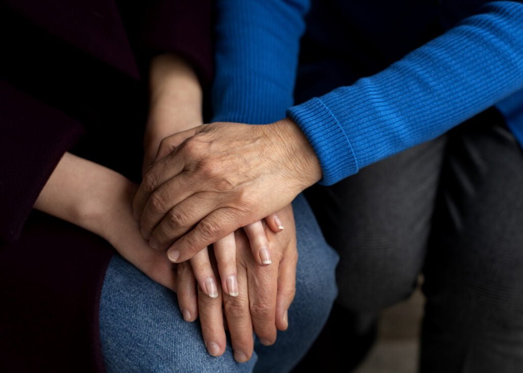 The Connection Between Self-Love and Healthy Relationships 3 hands holding each other support