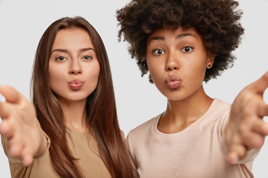 How to Stop Comparing Yourself to Others and Start Loving Yourself 4 Two women embracing others without comparison