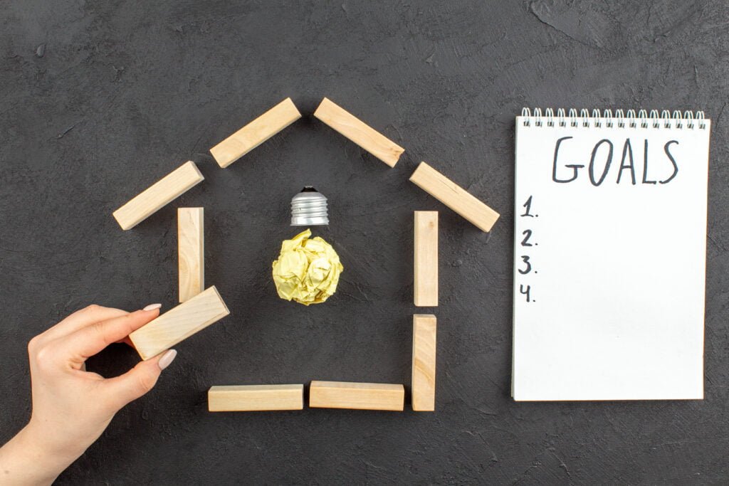 The Role of Self-Love in Achieving Your Life Goals 3 A woman setting up her goals