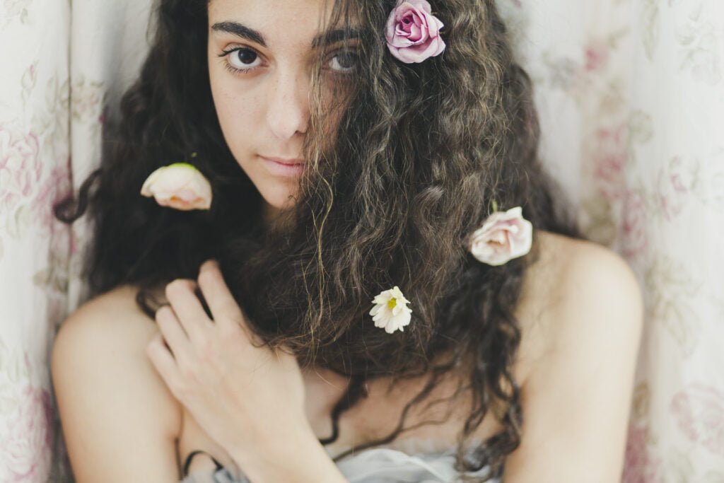 Self-Love and Feminine Energy - Unlocking Your Inner Power 4 woman with flowers hair looking camera