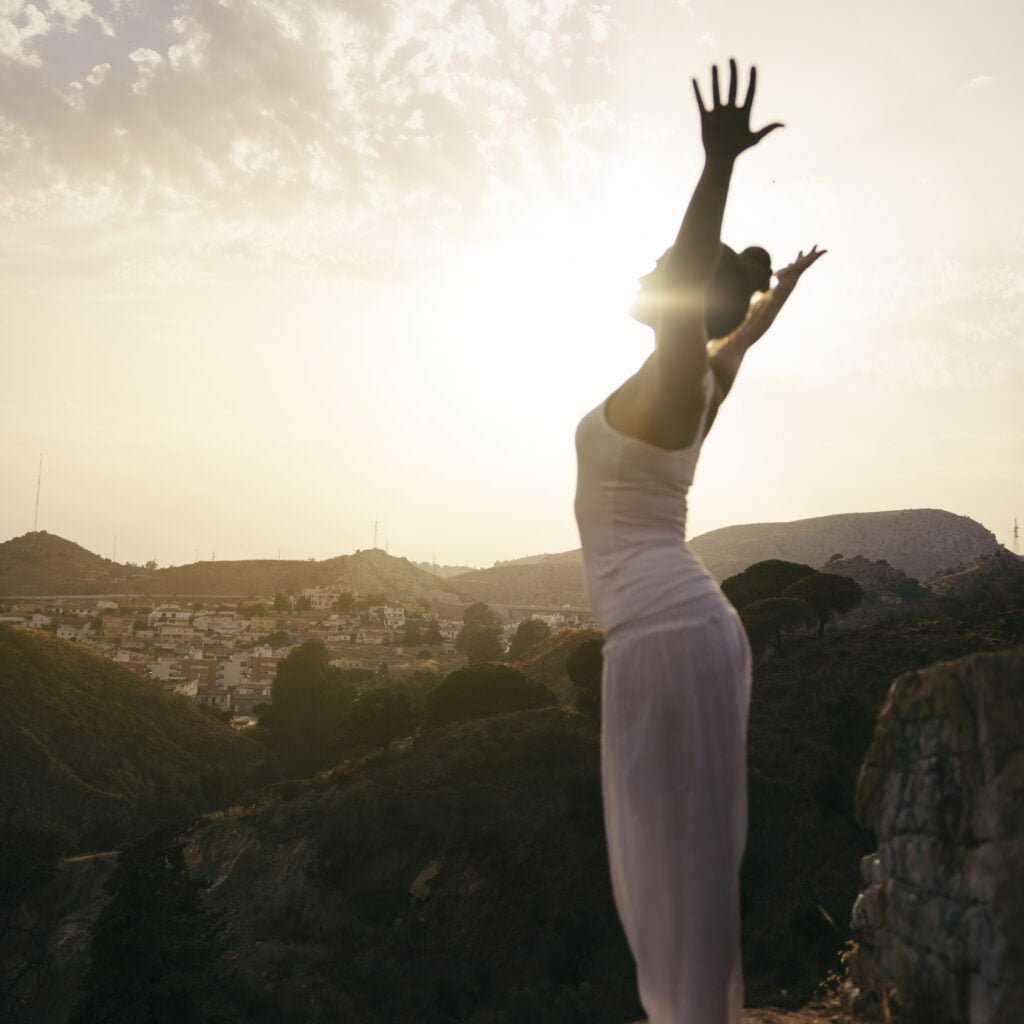 The Benefits of Self-Love for Physical Health and Wellness 4 A woman feeling grounded and balanced doing yoga
