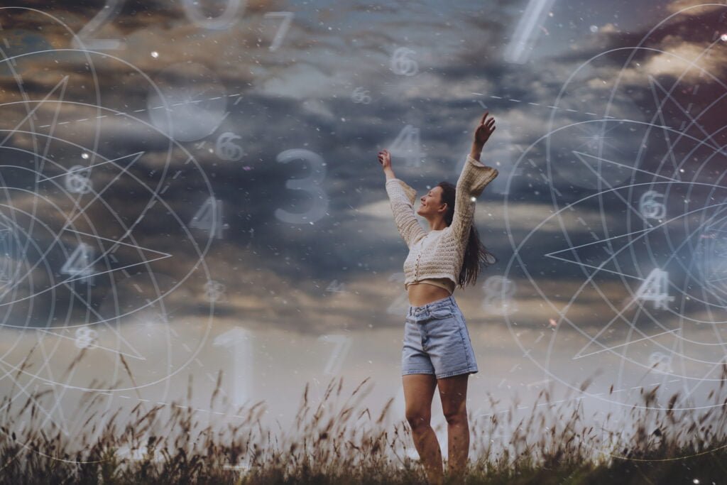 The Law of Attraction - A Comprehensive Guide for Beginners 3 abstract numerology concept with woman full shot