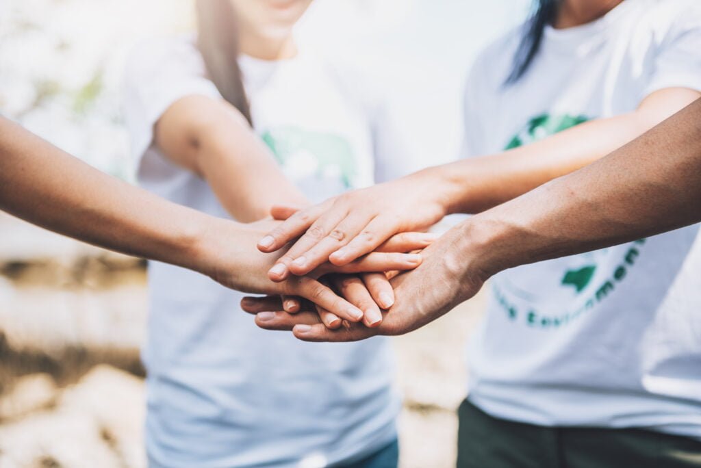 How to Foster Self-Love Through Volunteer Work and Giving Back 3 Volunteers deciding to make an impact