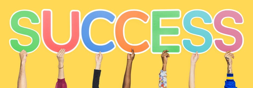 How to Use the Law of Attraction for Career Success 1 Hands holding the word success
