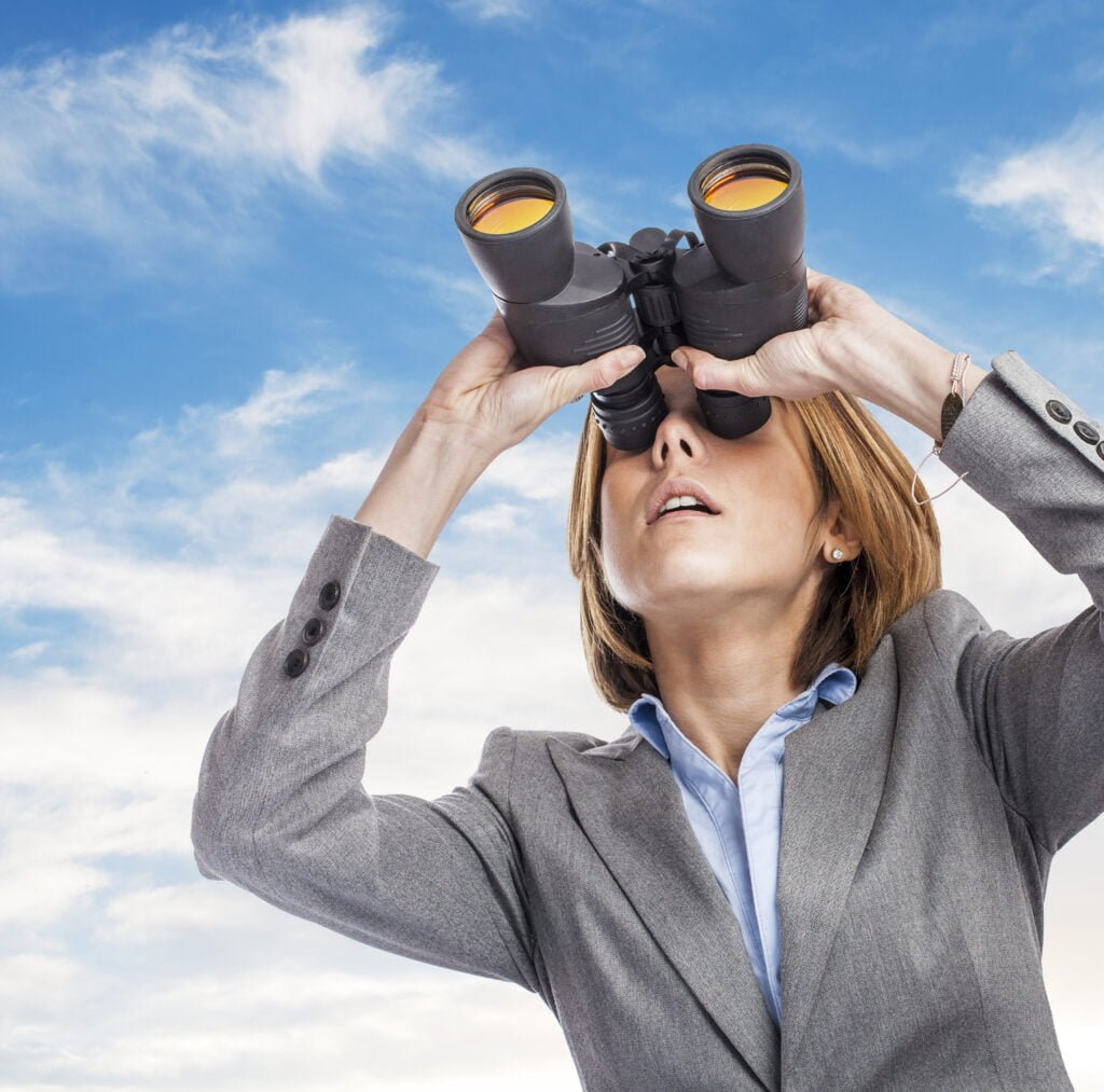 How to Use the Law of Attraction for Career Success 2 A professional woman keeping an eye on the end goal