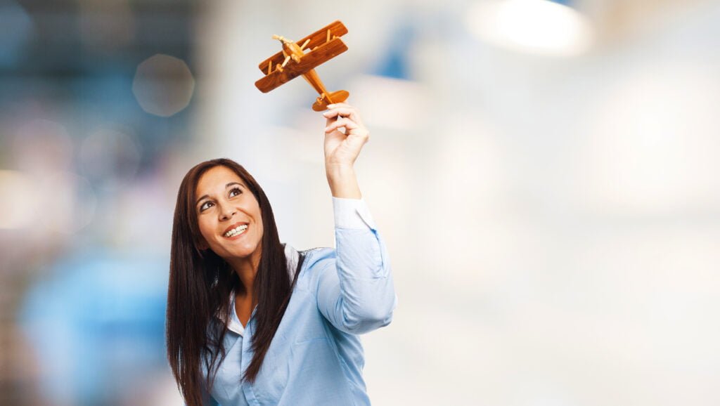 How to Use the Law of Attraction for Career Success 3 A woman imagining how she is flying high in her career