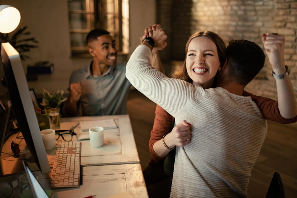 How to Celebrate Your Achievements and Boost Self-Love 4 A team of people, celebrating an achievement