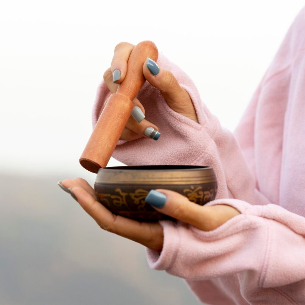 The Law of Attraction in Different Spiritual Traditions - A Comparative Study 4 A woman holding a singing bowl