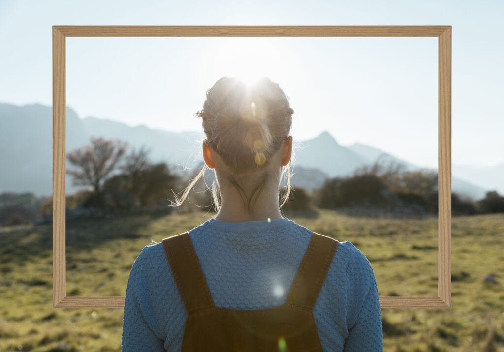 Integrating the Law of Attraction with Other Personal Development Practices 2 Person looking into th efuture through a frame