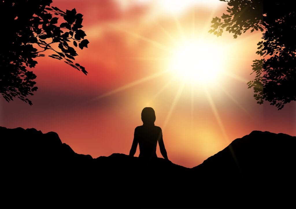 The Dark Side of the Law of Attraction - Addressing Criticisms and Ethical Concerns 1 Silhouette of a female sat against a sunset sky landscape law of attraction