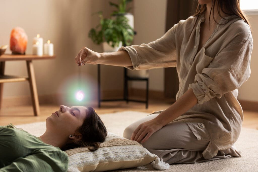 The Connection Between the Law of Attraction and Energy Healing Modalities 1 A woman receiving crystal energy healing