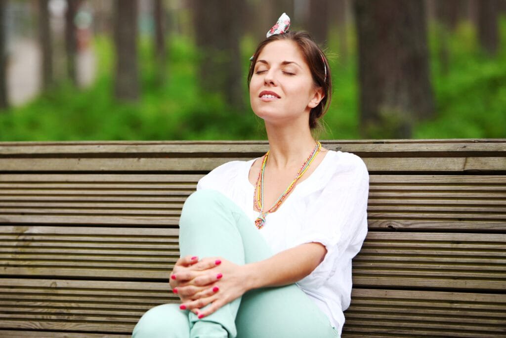 Using the Law of Attraction to Cultivate Inner Peace and Emotional Balance 4 A woman experiencing inner peace and balance