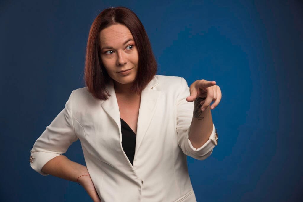 The Role of Physical Action in the Law of Attraction 3 A confident woman pointing towards her goals