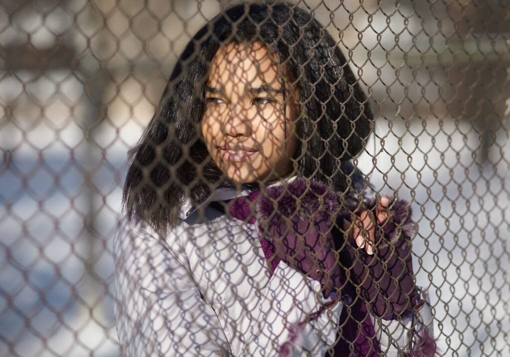A girl looking through her limiting beliefs