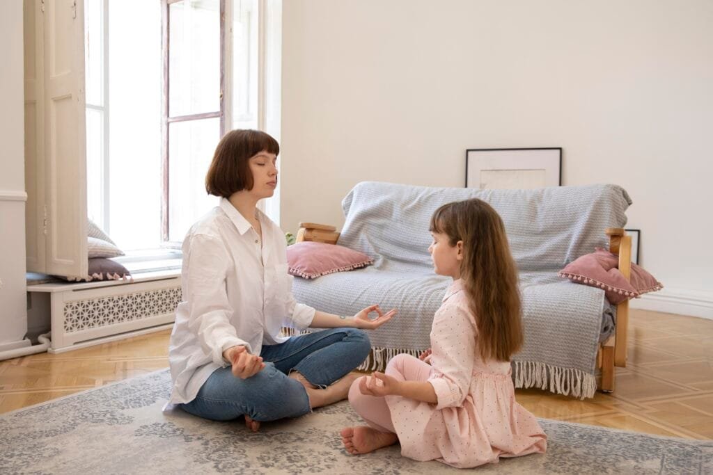 5 Mindfulness Habits That Transform Parent-Child Relationships 3 A mother and a daughter practicing breathing together