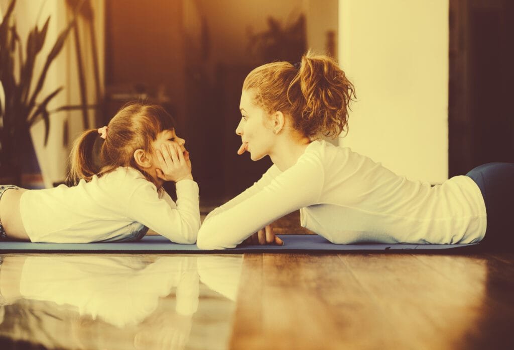 5 Mindful Breathing Techniques to Stay Calm as a Parent 2 A mother and a daughter having fun while practicing mindful breathing