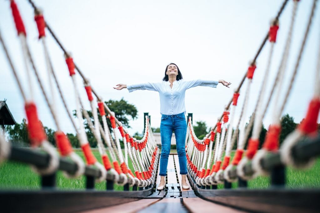 10 Powerful Techniques to Overcome Limiting Beliefs 4 A woman feeling truly happy without her limiting beliefs