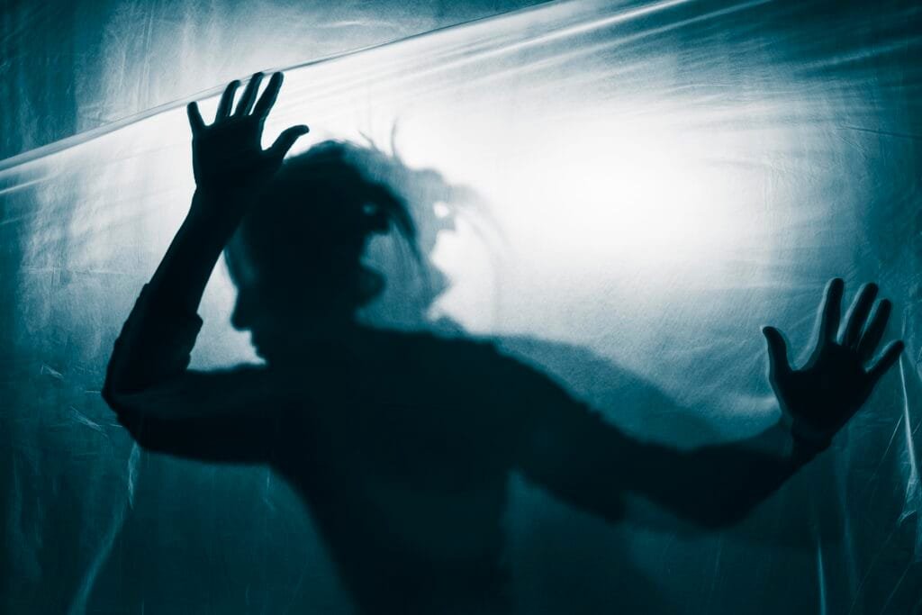 A person feeling trapped by limiting belief