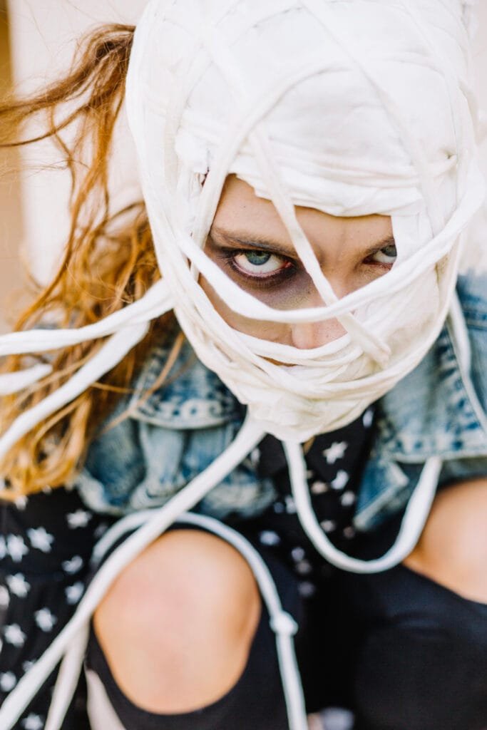 A person feeling blindfolded by limitng beliefs