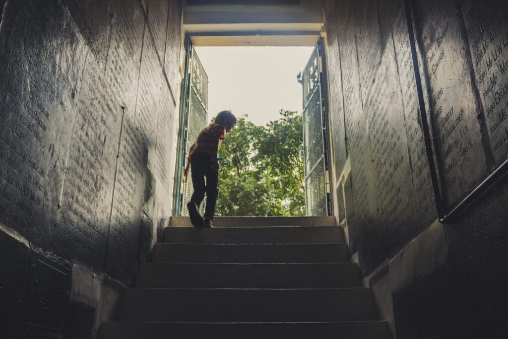 A person walking towards freedom and leaving their limiting beliefs behind