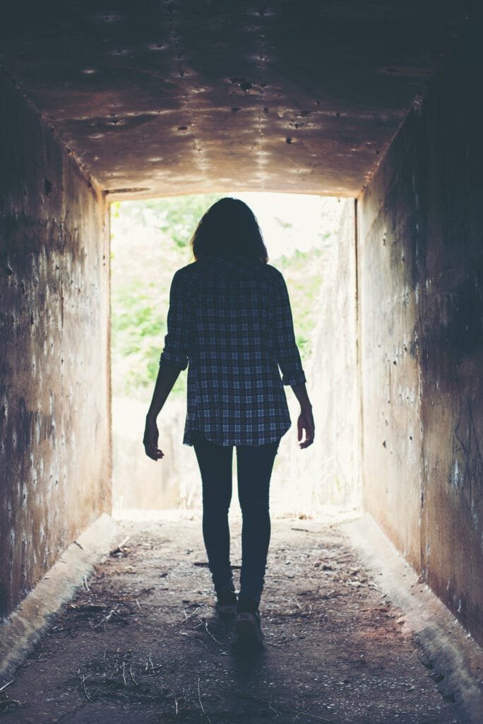 A woman seeing what true freedom is after leaving her limiting beliefs behind