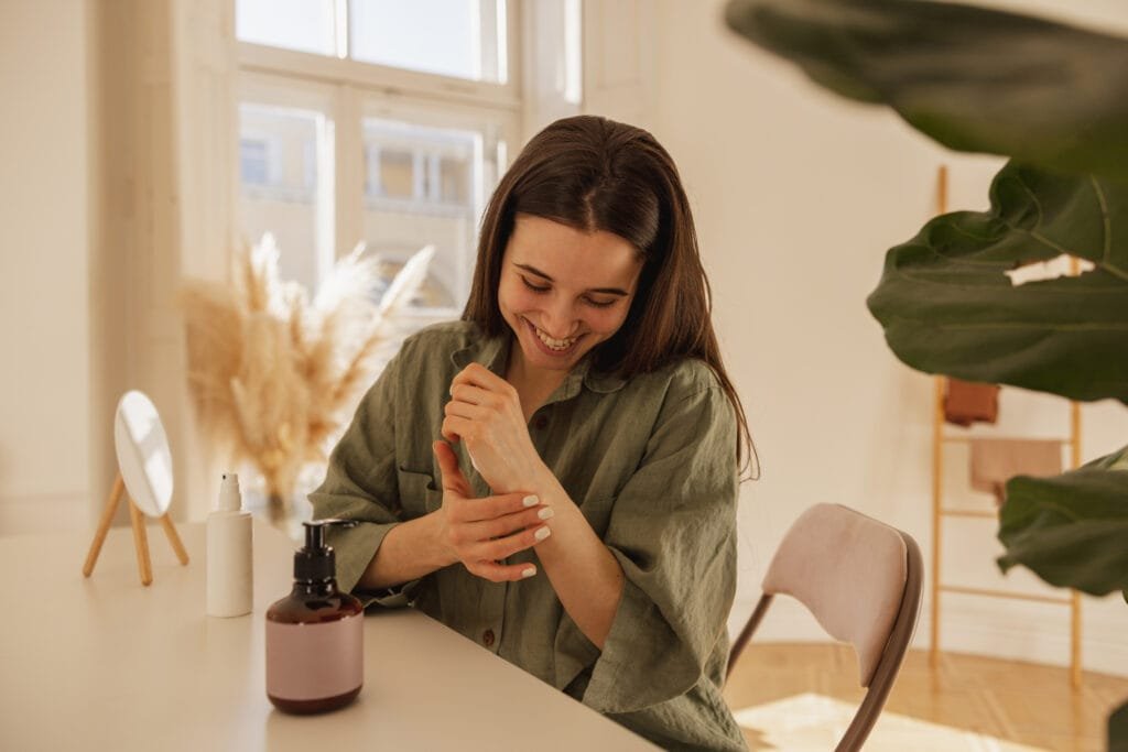 Parent Self-Care - Mindful Practices for Better Parenting 4 A woman applying hand cream as part of self-care