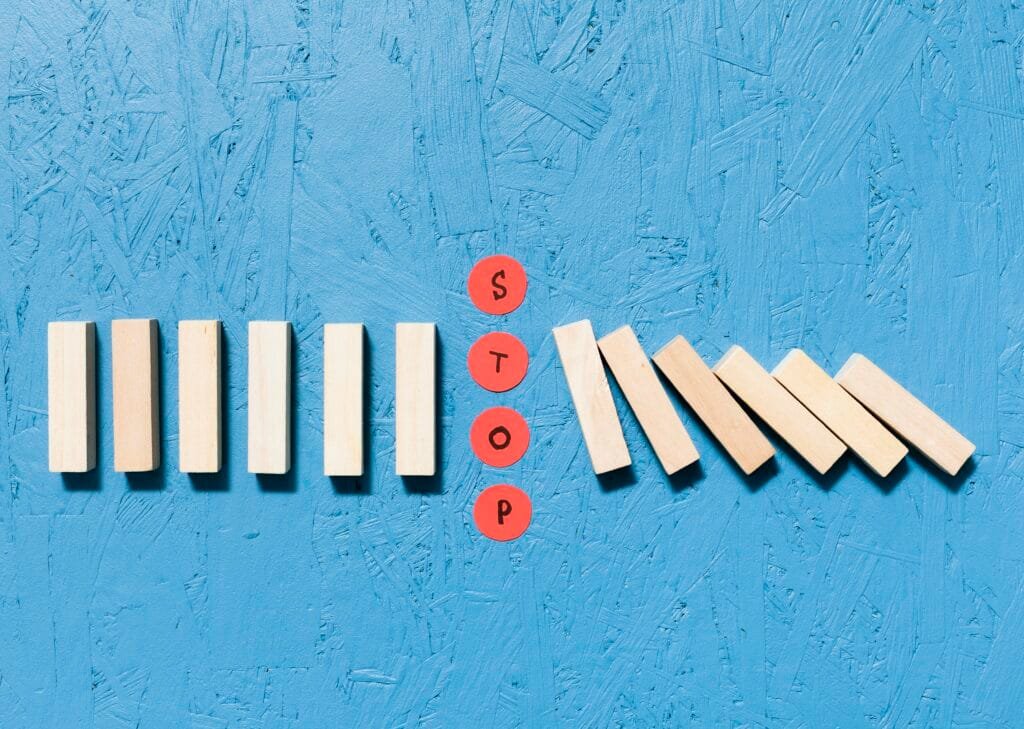 fallen wooden pieces red stop dots concept