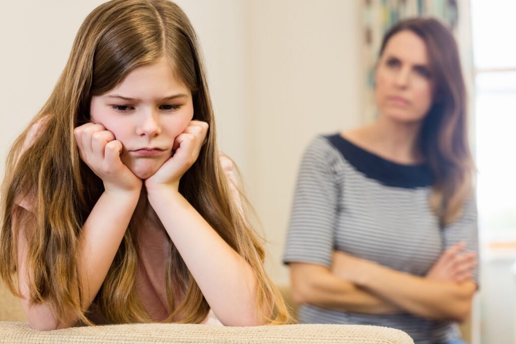 Mindful Parenting 1 daughter sitting upset with her mother living room